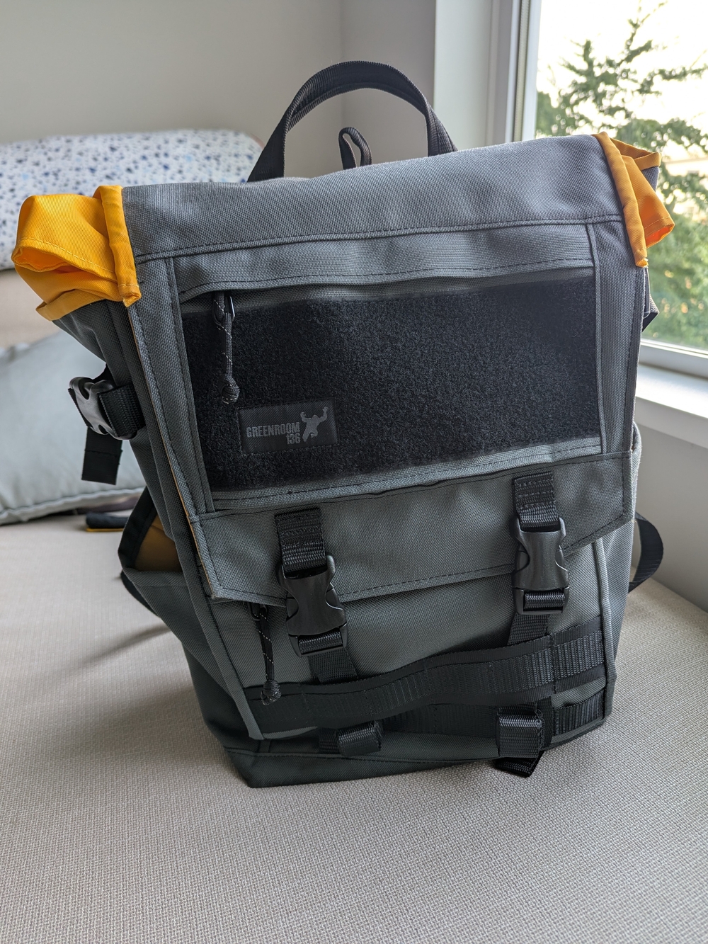 Gray Roll-Top Messenger Backpack with Yellow Accents